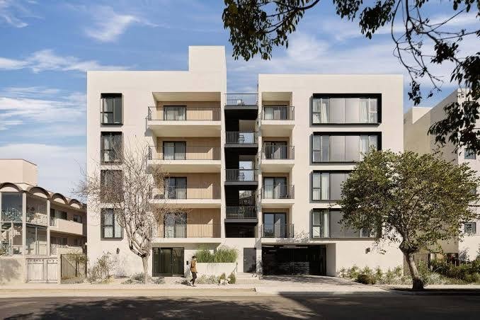 Modern multi-residential complex exterior displaying scheduled strata and body corporate pest management services across South East Queensland by JC Pests.